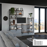 Ladder style shelving system of different heights with books and ornaments on in a lounge area