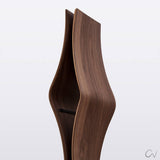 A close up of one of the shelves on a wavy contoured walnut wood wine rack