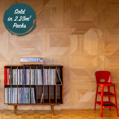 A oak ribbed wall design in abstract shapes. The room it is in is retro styled with record albums and a record player.