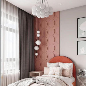 A childrens bedroom with circle shape 3D panels painted rust red.
