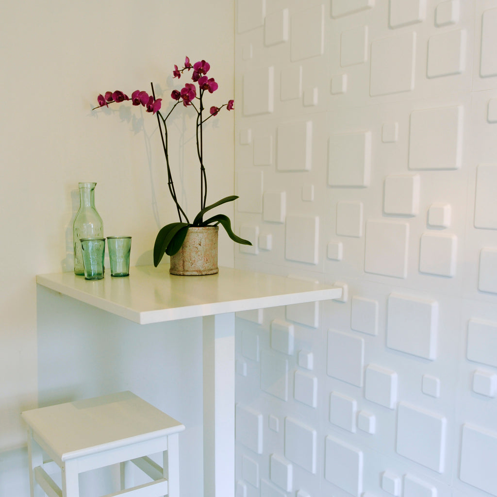 3D wall panel in a square design. The panel includes 3D squares varying consistently in 3 sizes