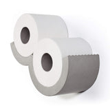 Designer bathroom toilet paper dispenser. The concrete 'blades' for easy one handed toilet paper dispensing.
