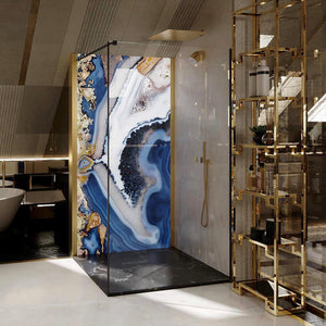 The Maui Blue wall panel installed in a shower enclosure as it is waterproof. The bathroom it is set in includes gold accessories.