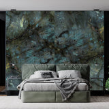 The image is looking at a double bed in greens and greys. Behind the bed is the Stardust wall panels in similar green colours.