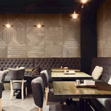 A restaurant in warm browns and natural woods. The back wall features the contemporary wood wall panel Vogh