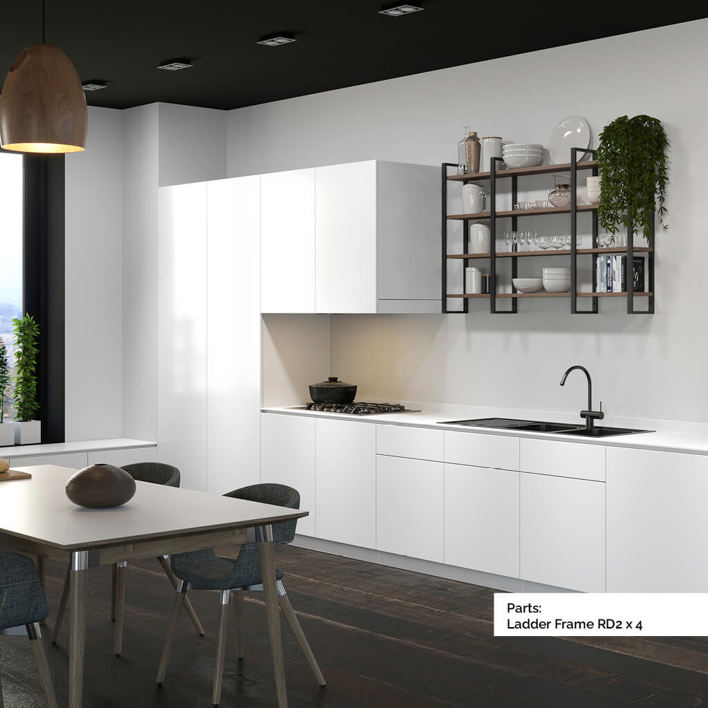 White kitchen with wall mounted shelving that has black metal frames and wood shelves. The shelves have crockery and plants on
