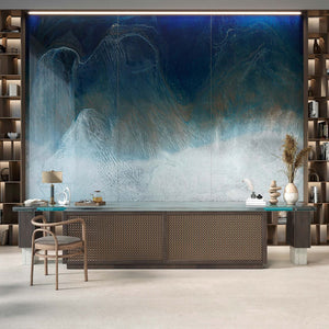 A luxury office and desk with a large glossy blue wall design behind it. The design resembles waves in the ocean