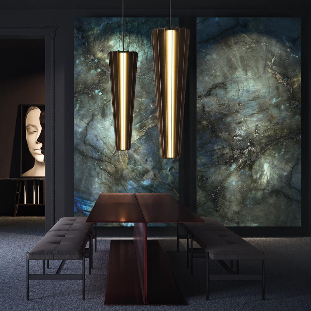 A dark, moody and stylish dining room where  there is Stardust wall panels installed as if they are large art installations. 