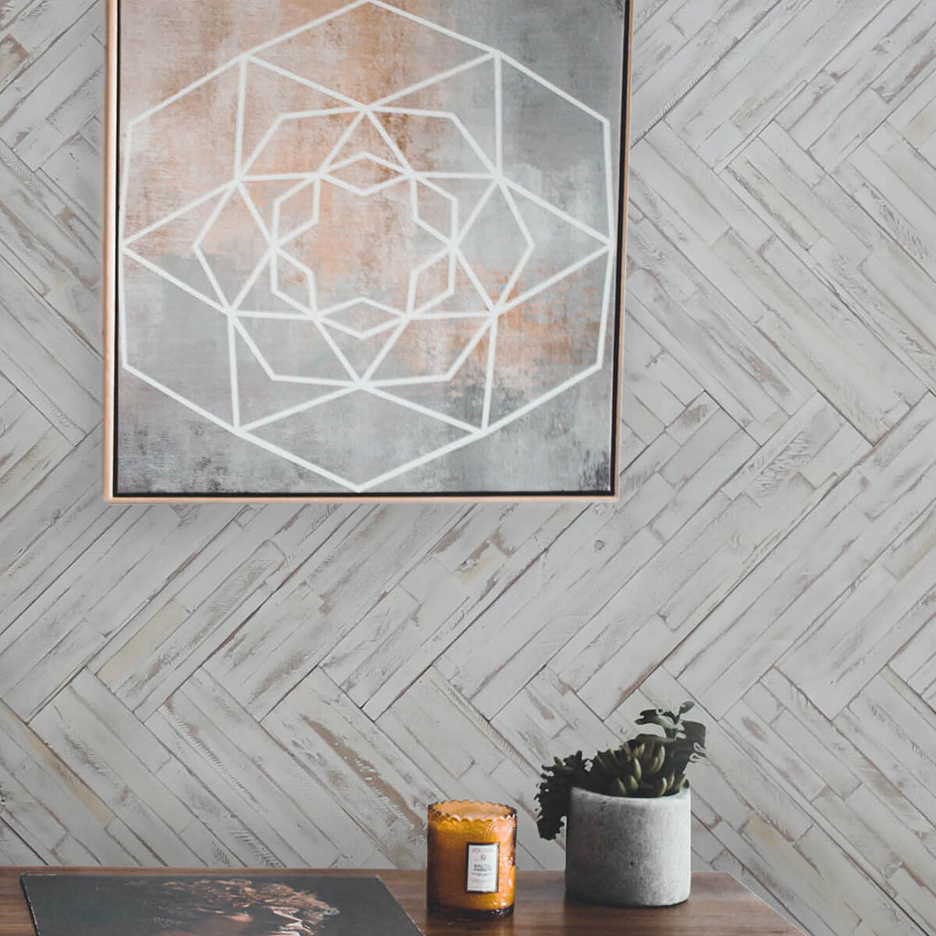 DIY wood wall panelling applied to a home interior with wall decor added