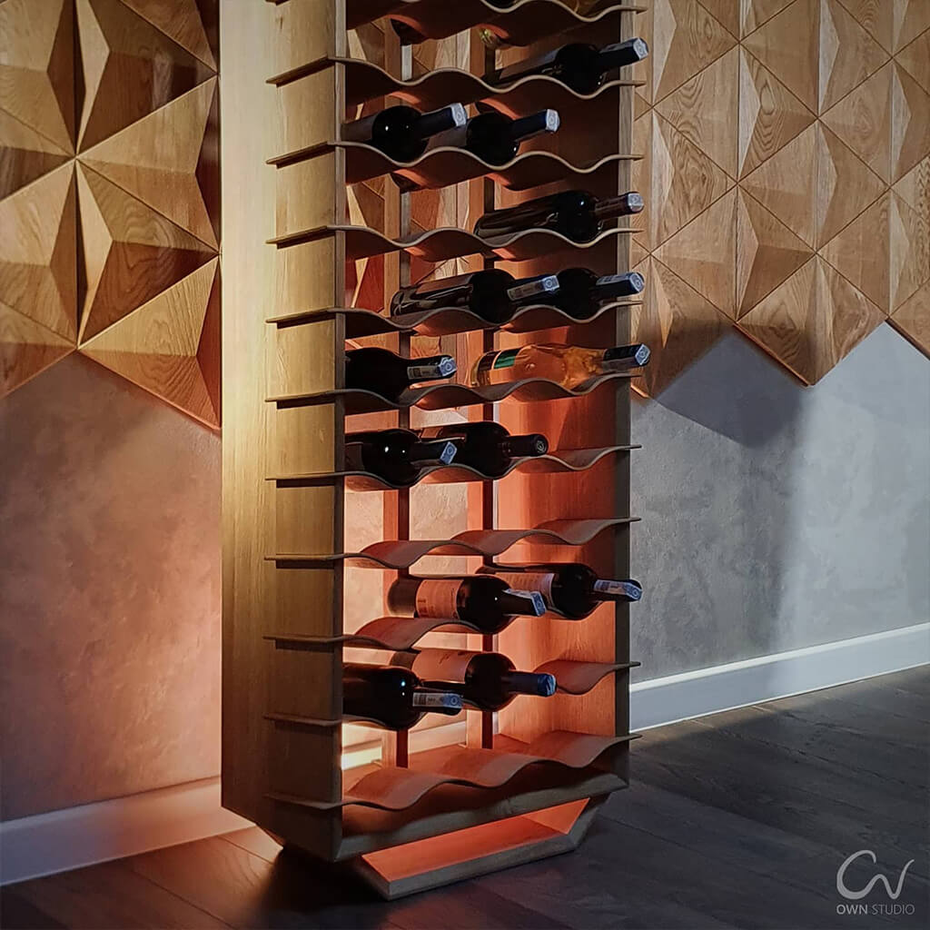 Large freestanding wooden wine rack holding bottles of wine in front of a 3D wood feature wall