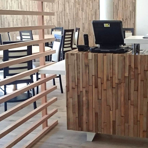 A cafe where the back wall and counter had been clad in the maple wood wall panels.