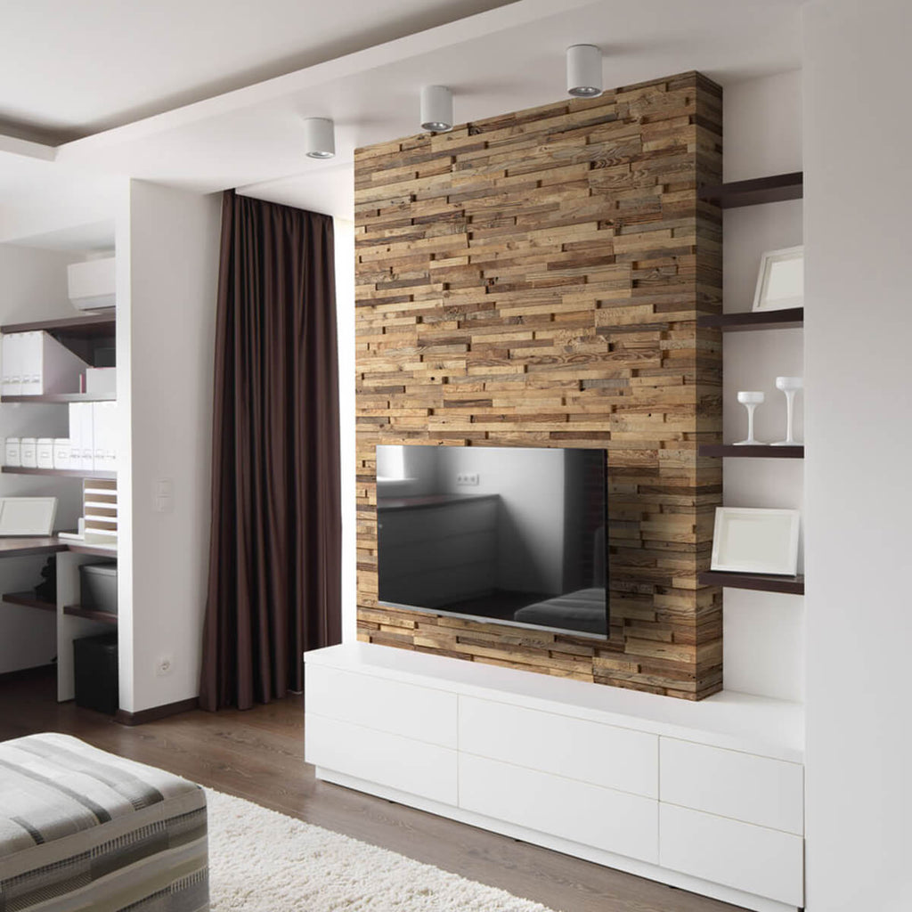 Reclaimed wood wall panelling used as a feature wall behind a tv unit