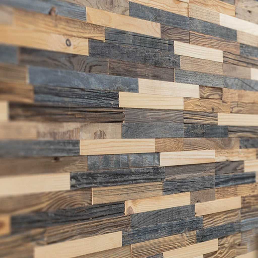 Close up of reclaimed wood wall panels. The close us shows the variation in different wood colours and textures used. Each piece of wood is cut in a thin rectangle 