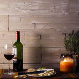 self adhesive wooden wall panels in the Safari finished used as a backdrop in a cosy dining room.