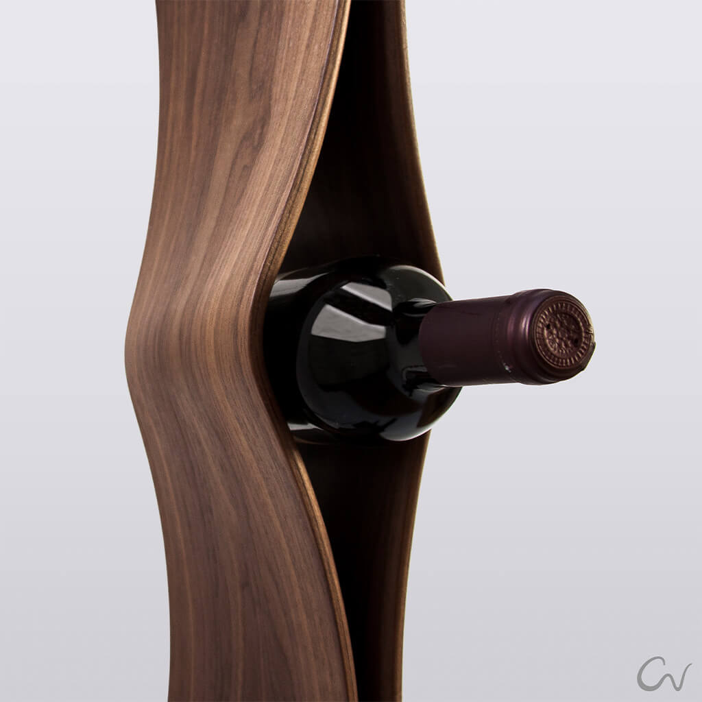A close up of a walnut wood wine rack shelf holding a wine bottle 