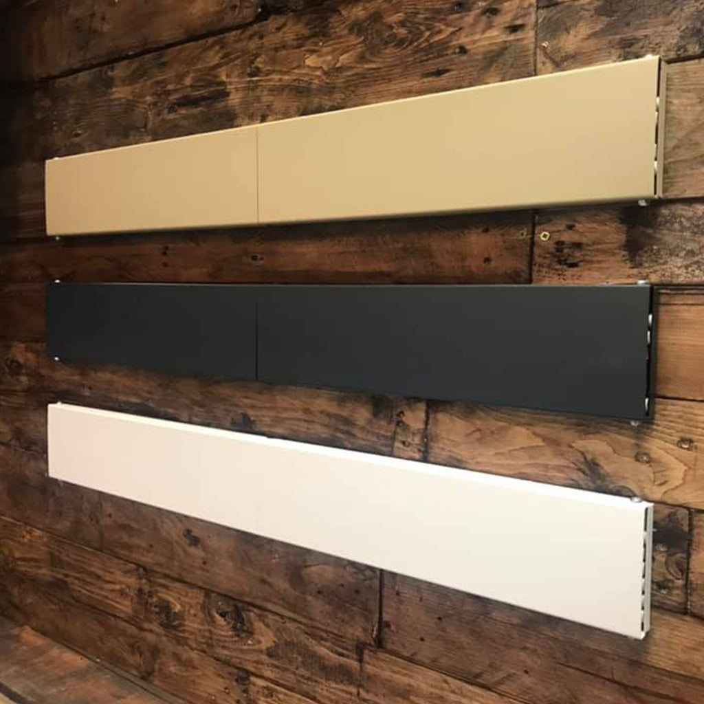 3 wall mounted airers installed on a wooden wall. The airers are in the 3 colours gold, anthracite and white.