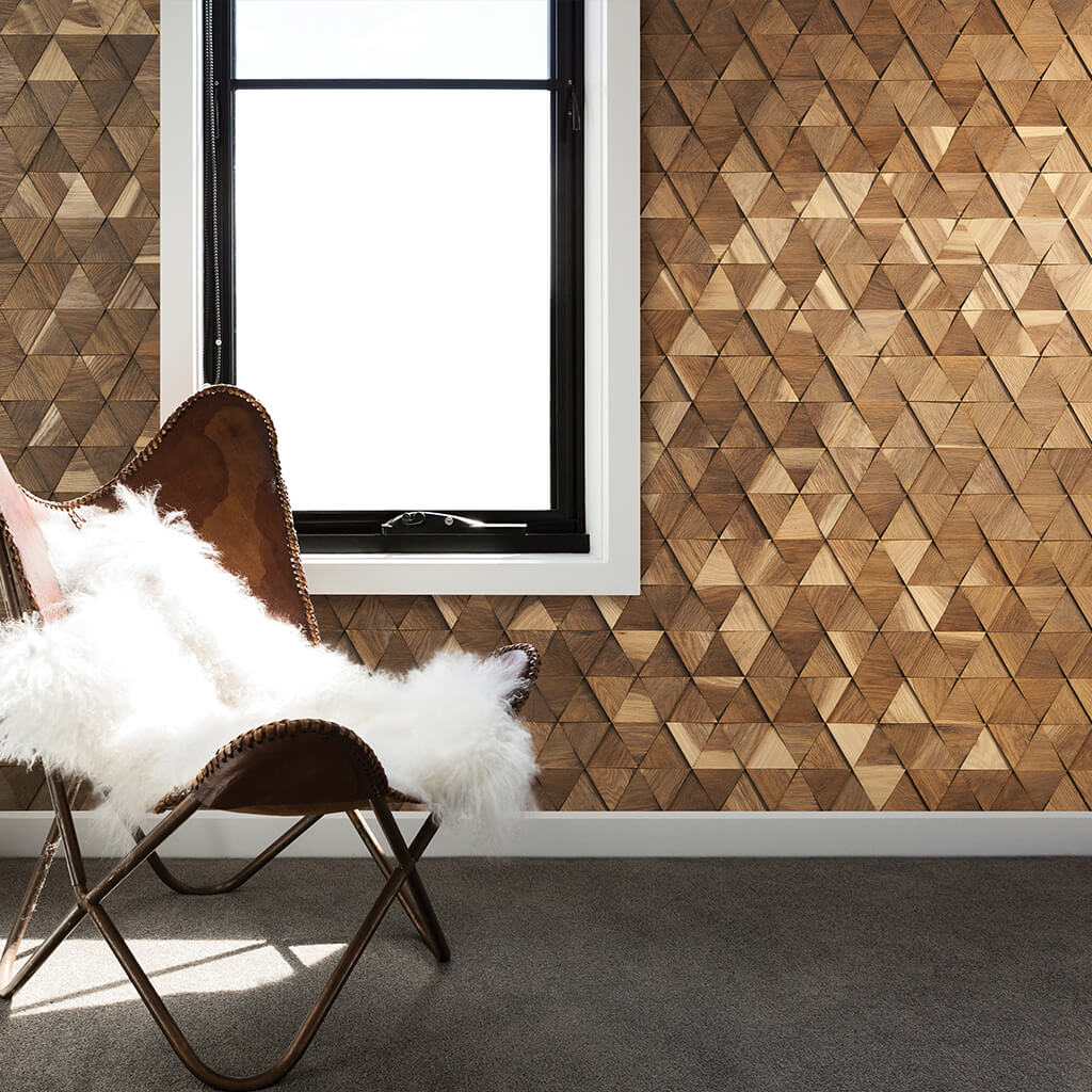 A wall with a window. Clad with small triangle 3D wood wall panels from mix colour woods